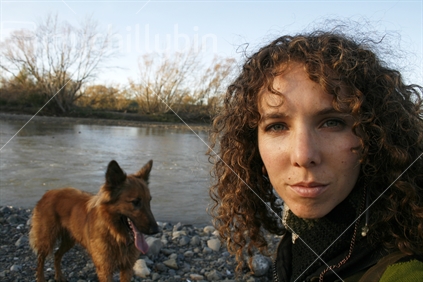 Dog and lady by the river