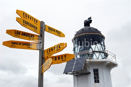 Lighthouse and signpost, Cape Reinga, New Zealand