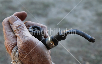  An older man smoking a pipe