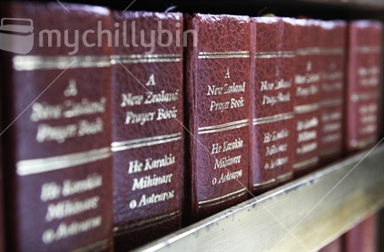 New Zealand Prayer Book in English and Maori, in a church bookcase.