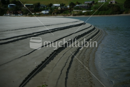 Graduated sand on the waters edge, Taieri River, Otago, New Zealand