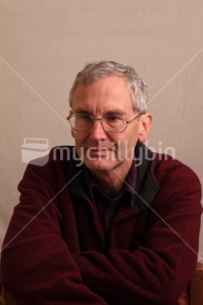 Man in 50's age bracket looking bored