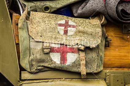 Old WWII canvas first aid satchel on the back of an NZ Army tank.  