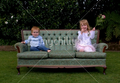 Two cuties on the couch, in a New Zealand garden.
