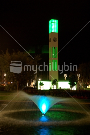 Clock tower & water feature in the centre of Palmerston North city, at night, New Zealand