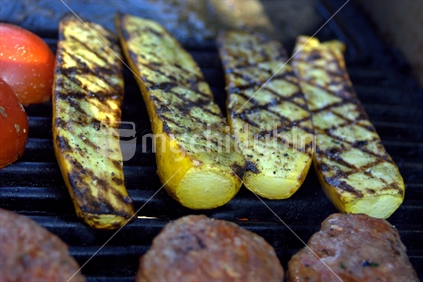 Yellow courgettes on the BBQ