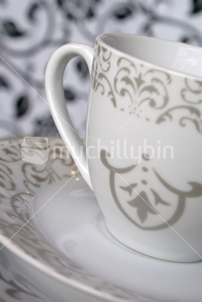 Close-up of silver and white tea set