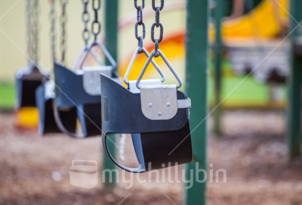 Empty swings in a playground