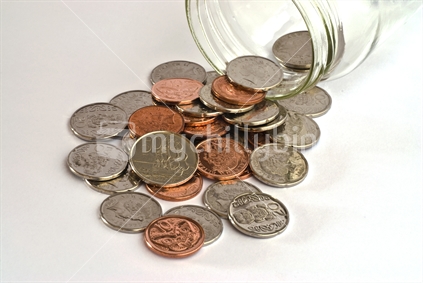 New Zealand coins in a savings jar.