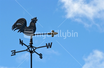 Weathercock silhouetted against a blue New Zealand sky