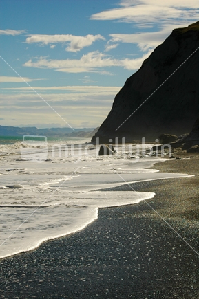 Rugged East Cape beach on a summer day, New Zealand