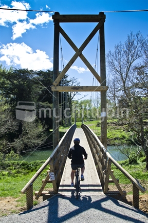 Cyclist about to cross bridge
