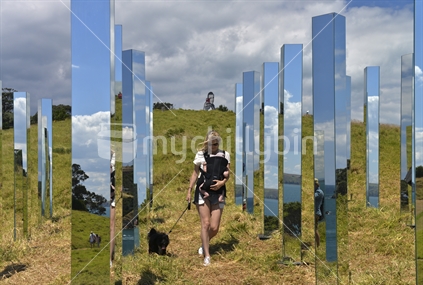 Girl, Baby and Dog amongst mirrored sculpture