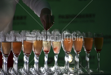 Champagne cocktails being stirred