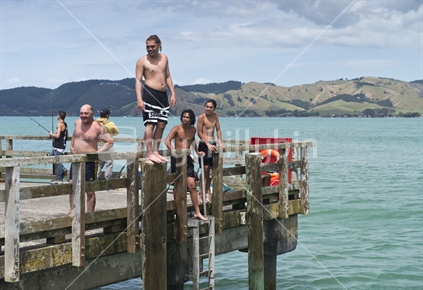 Ready to Jump, young adults on wharf 