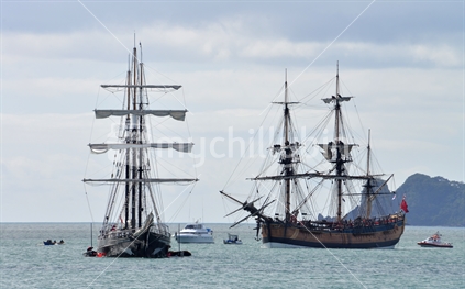 Captain Cook's Endeavour  and Spirit of New Zealand anchored at Wharekaho Beach, Mercury Bay.