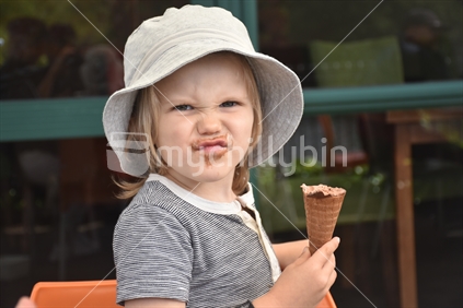 Boy Eating Chocolate Ice Cream - Perplexed