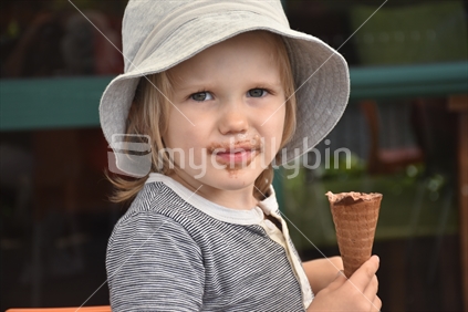 Contented Boy eating Chocolate Ice Cream