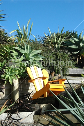 Wooden sun chair facing sun