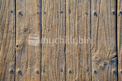 Wooden decking with sand