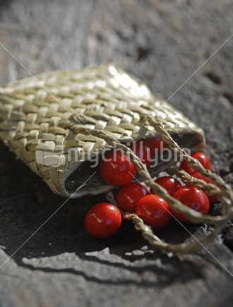 Red sweets spilling out of flax bag