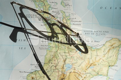 New Zealand map and glasses with shadow