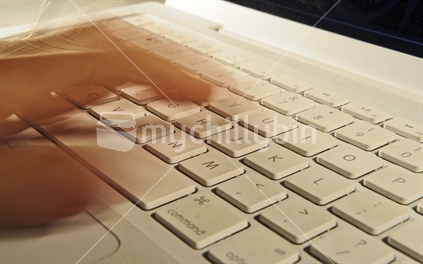 Blurred Hand on Keyboard