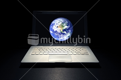 Laptop computer with image of world on screen.