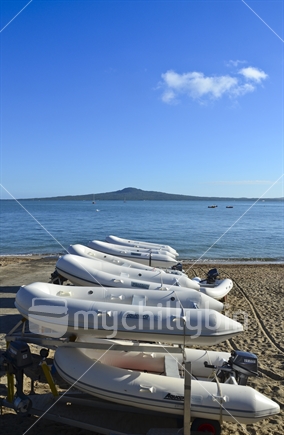Inflatable dinghys lined up on beach