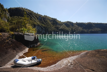 Beached rubber dinghy at Lake Taupo, New Zealand
