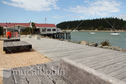 The walkway near the ampitheatre at Mapua Wharf, with Rabbit Island in the background