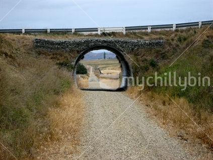 A section of the Central Otago Rail Trail passing under the road, South Island