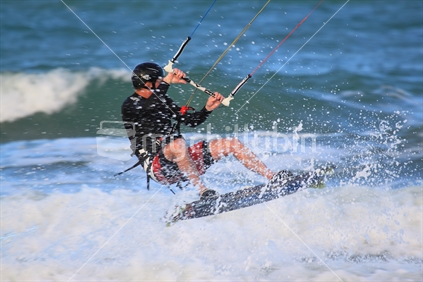 A kite surfer in action