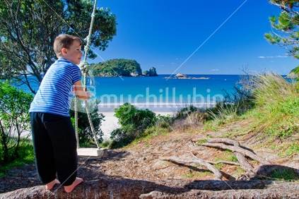 Boy swinging at Ha Hei beach