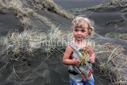 Child among tumbleweed
