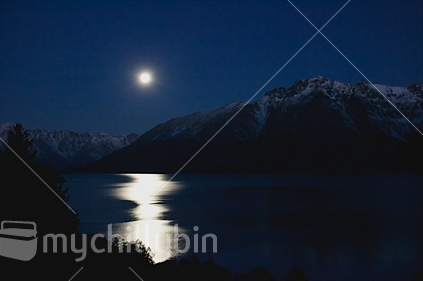 Taken just after sunset, this image was taken from the road to Glenorchy just as the moon was rising to create a shimmer on Lake Wakatipu. (HIgh ISO image)