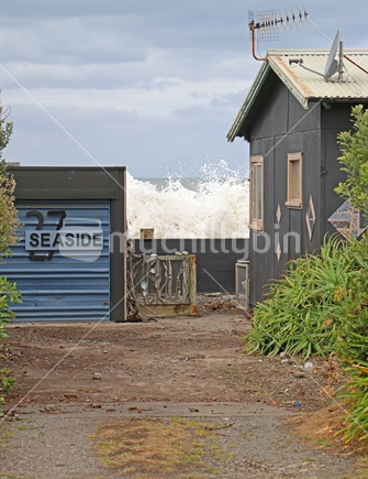 House threatened by coastal erosion and rising sea levels.  Hawkes Bay