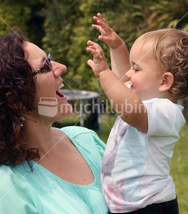 Mother laughing with child