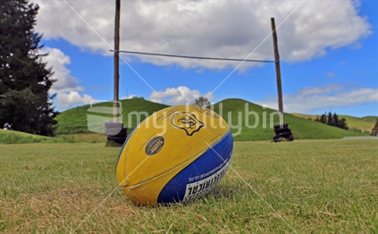 Kotemaori school old goal posts with rugby ball