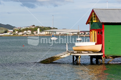 Wellington's iconic boat sheds in Evans Bay with the new event centre in the background