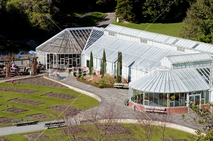 The begonia house in Wellington's Botanic Gardens with the popular cafe. The rose garden is bare because it is winter.