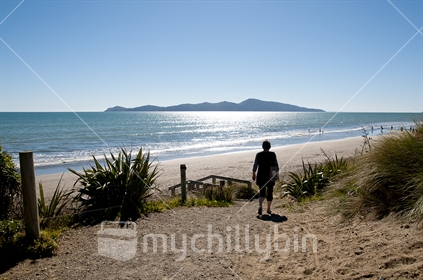 Wellington's west coast sandy beaches looking towards Kapiti island with the afternoon sun on the water 