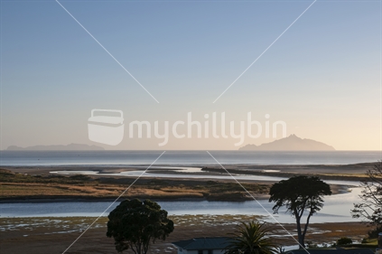 Looking over the Waipu River estuary towards Bream Bay and in the distance the Hen and Chicken islands. Taken in the dawn light