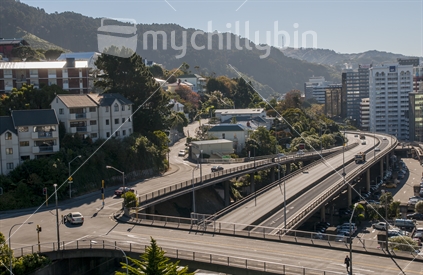 Wellington city in the afternoon sun showing the Terrace onramp to SH1. The Tinakori Hills to the left and Wellington High Rise buildings to the right