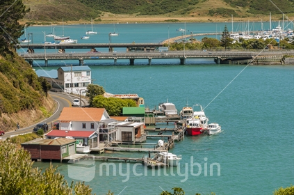 The boat sheds and bridges at Paremata with the Porirua Harbour in the distance
