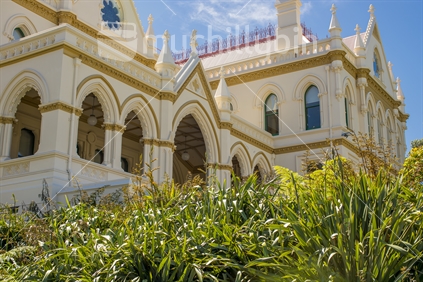 The Parliament Library is one of three Buildings on Parliament Grounds. The image showing flax in the foreground. The Library was restored in the mid 1990's.