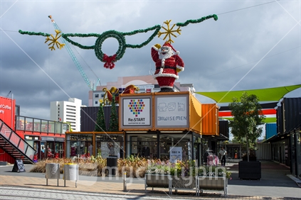 Christmas at the new start container shopping mall in Christchurch, competing for the skyline with a construction crane.