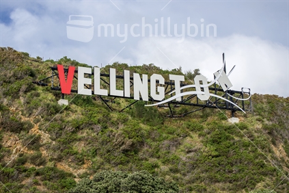 The wellington sign on the Miramar hills near the airport, with the W replaced by a red V, to make Vellington, celebrating the vampire mockumentary, 'What We Do In The Shadows'.