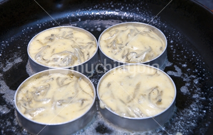 Preparation of whitebait fritters, from cooking to plating.

