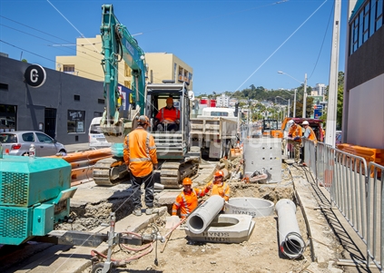 Construction workers intalling drainage system pipework at Victoria St, Wellington